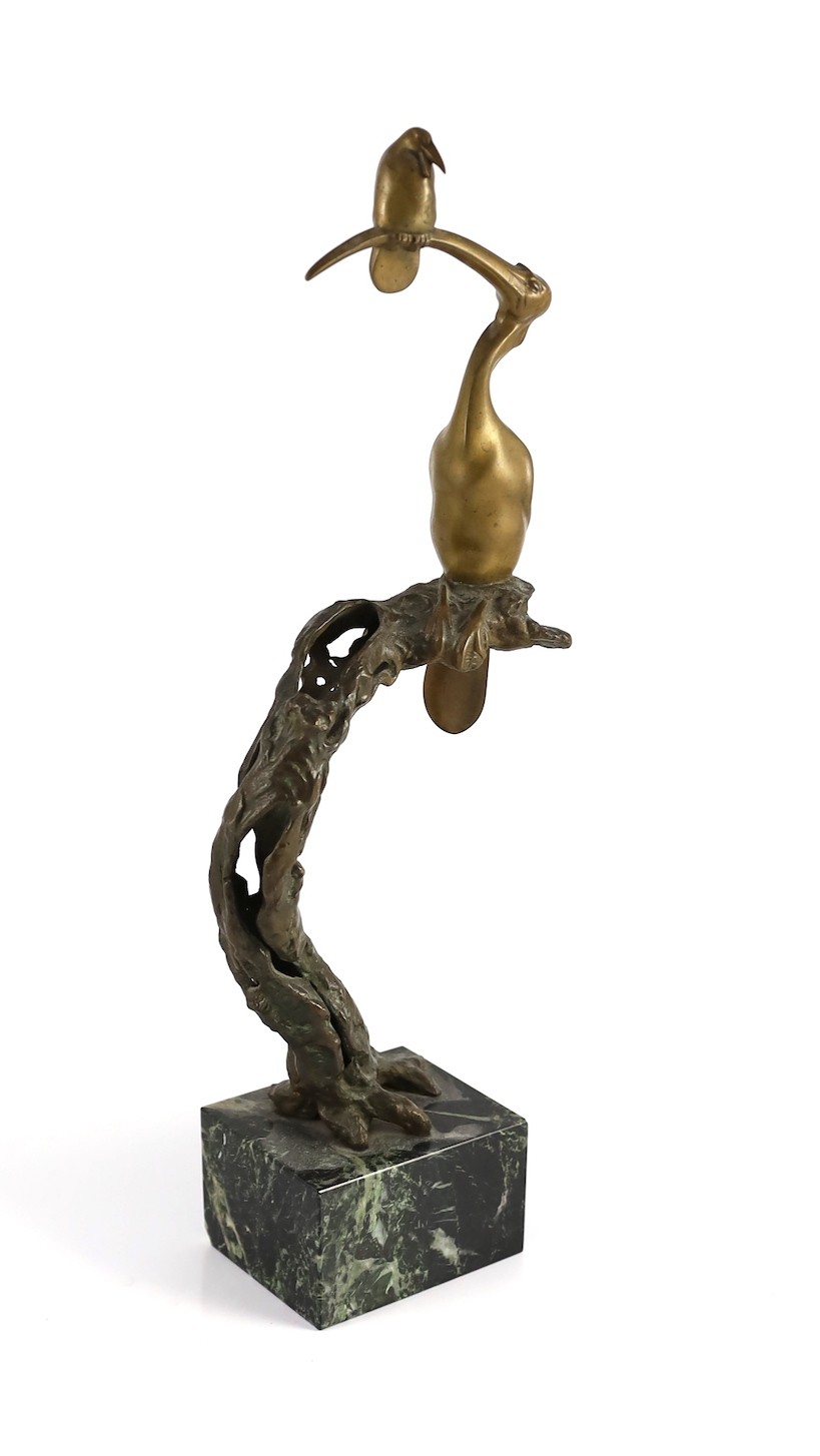 Josef Franz Riedl (Austrian, 1884-1965). A bronze group of two birds perched upon a tree trunk, 45cm high